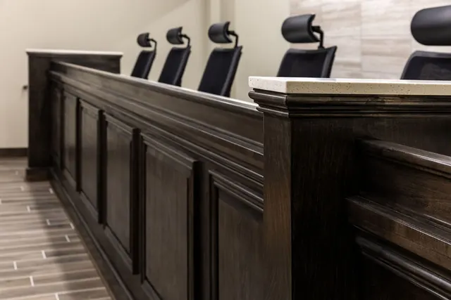 Dark wood council dais and leather chairs in Jacksonville City Hall