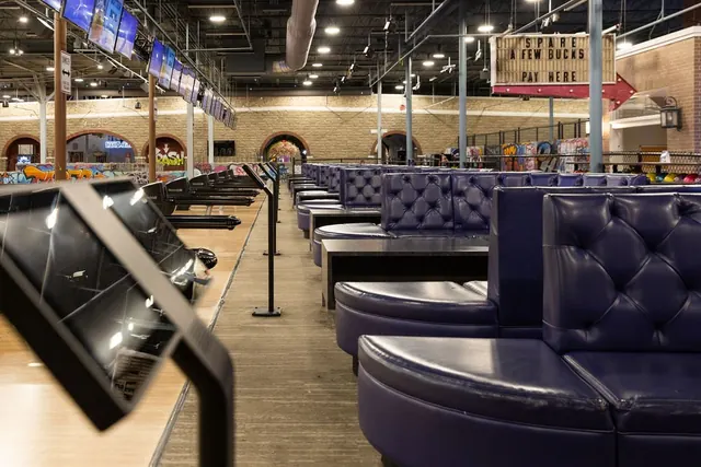 Tufted lounge seating at the bowling lanes in The Alley