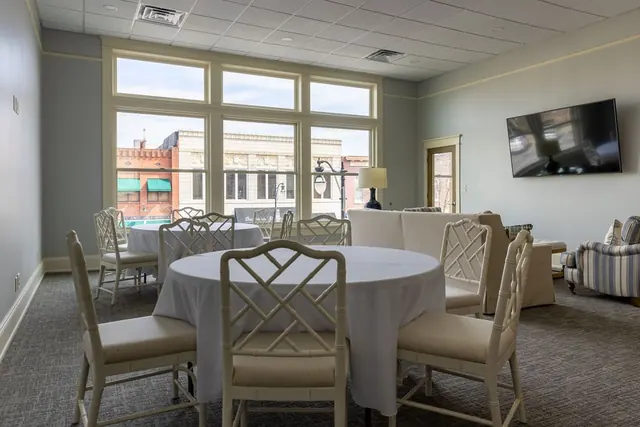 Dining room with a round table and a view of downtown Gadsden