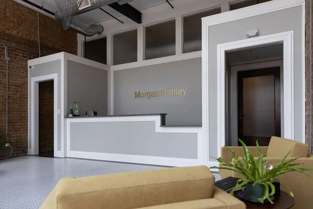 Morgan Stanley reception desk against old brick