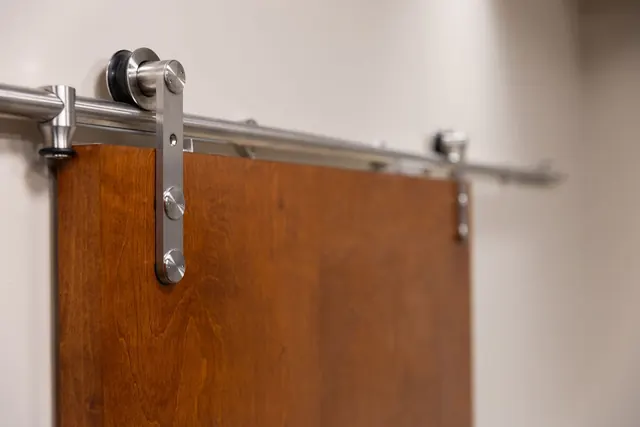Sliding barn door on a steel track