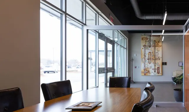 Conference table by a wall of windows at the Industrial Development Authority offices