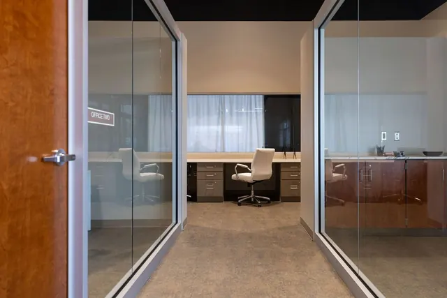 Glass-walled private office at The Venue