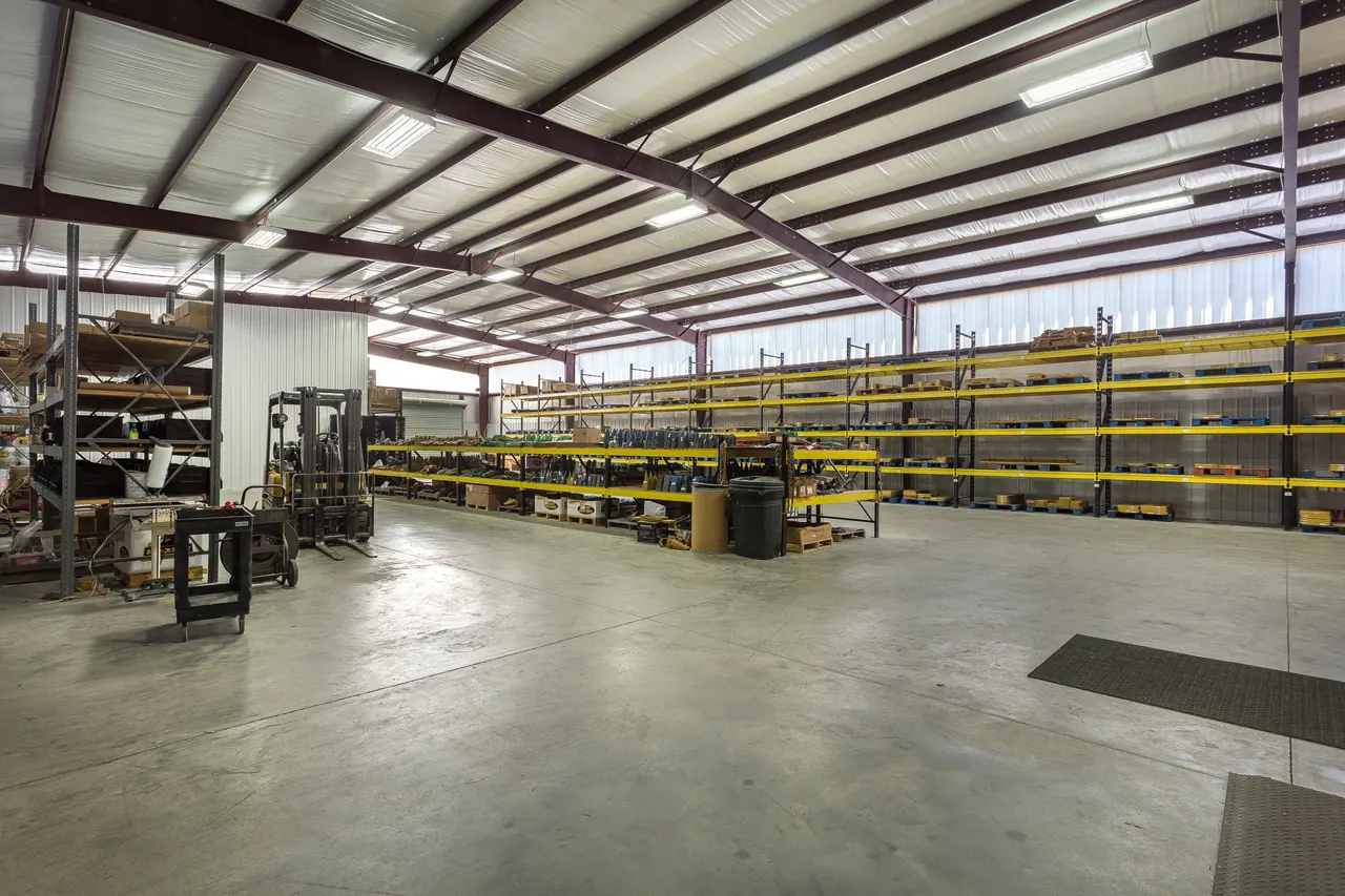 Batey & Sanders warehouse under red steel frames