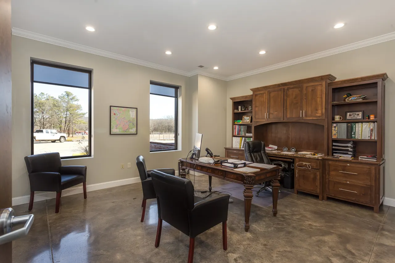 Private office with wood desk and bookcase at Batey & Sanders