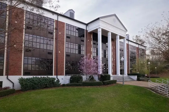Brewer Hall at Jacksonville State University, three stories of brick behind white columns