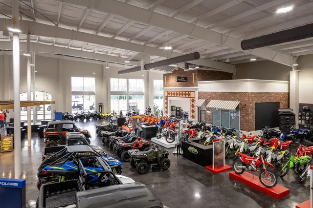 Mountain Motorsports showroom floor full of dirt bikes and ATVs