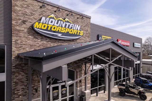 Mountain Motorsports sign over the stone entrance