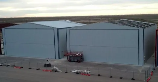 Two finished metal hangars at the Midland airport