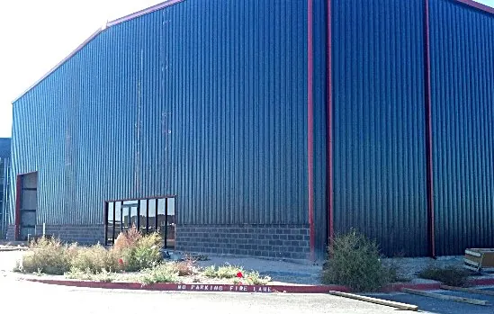 Blue hangar wall and entry